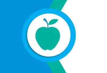 Green apple on a white, blue, and greem background. 
